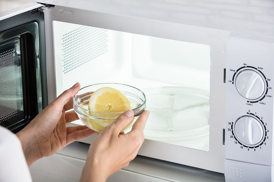 Step-by-step process of cleaning a microwave