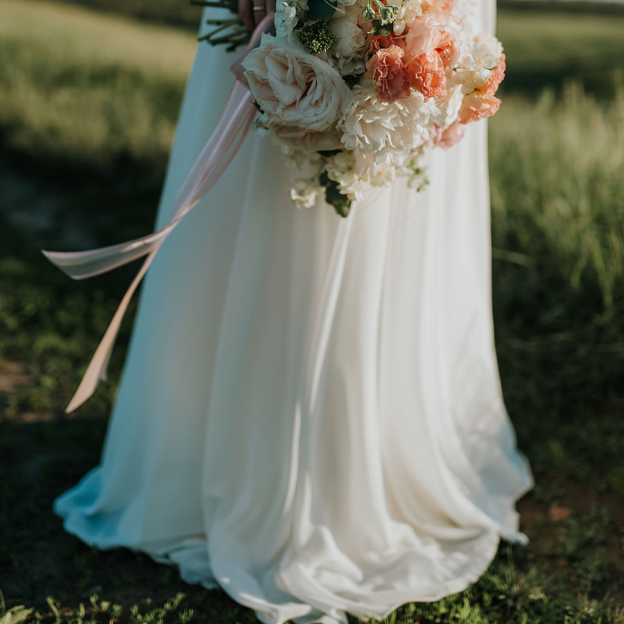 Person demonstrating the process of removing grass stains from fabric