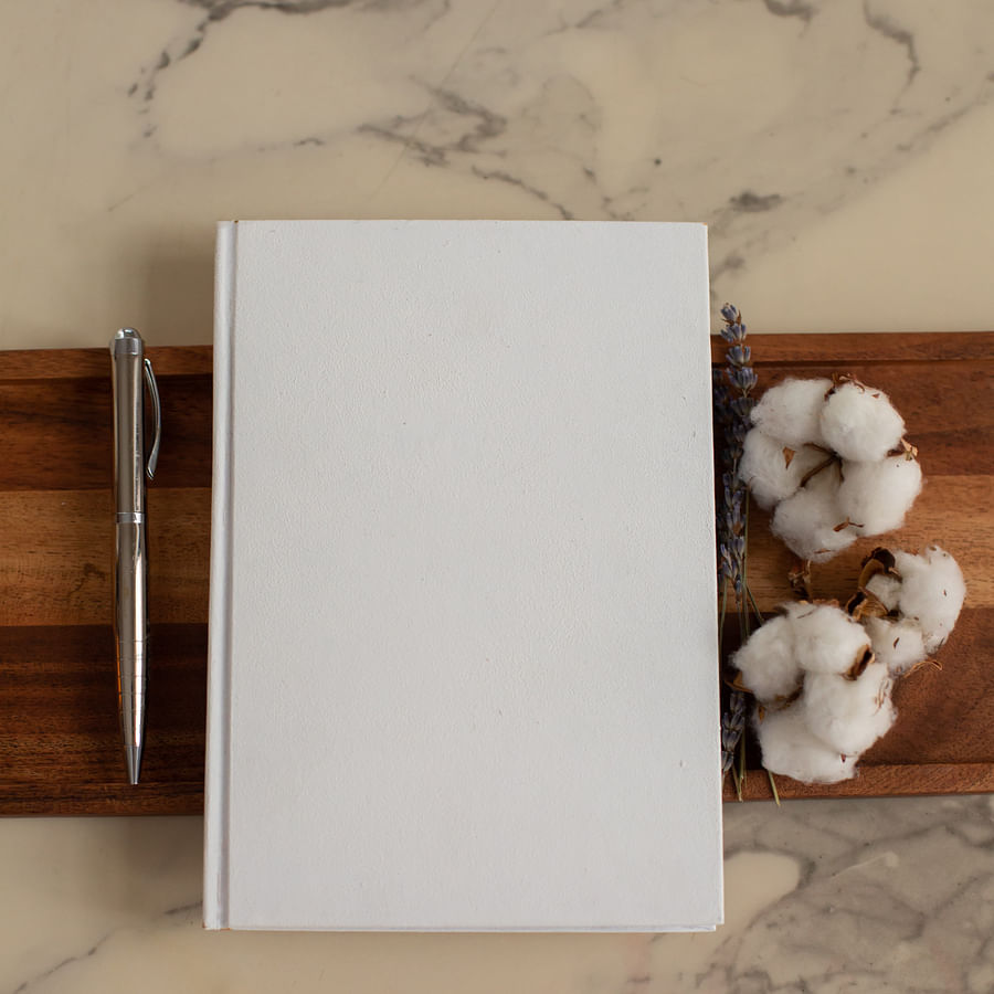 Spacious clean bedroom with neatly arranged bed and organized furniture