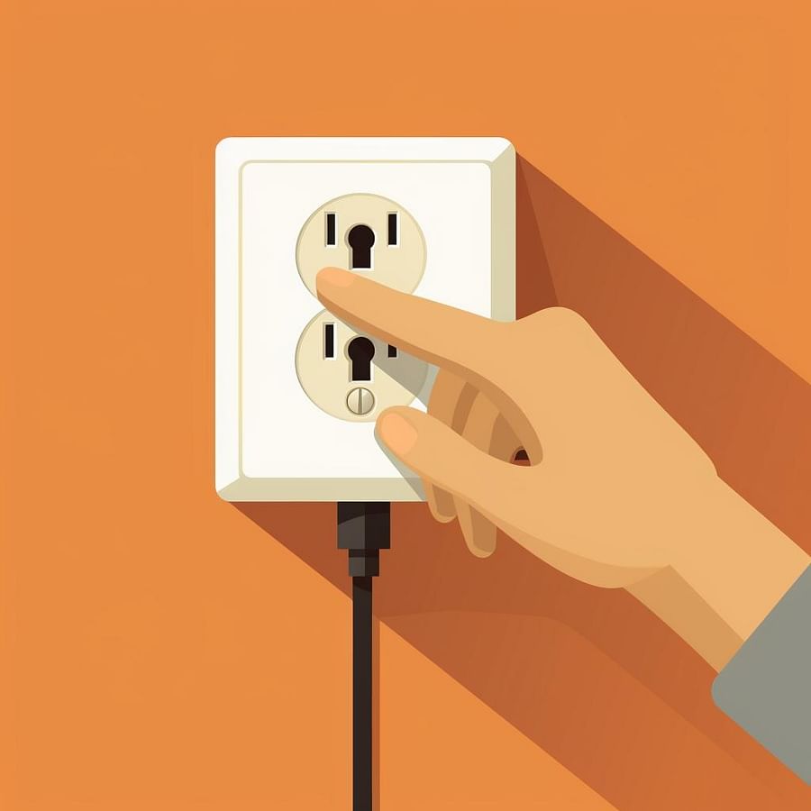 A hand unplugging the dryer cord from the wall socket